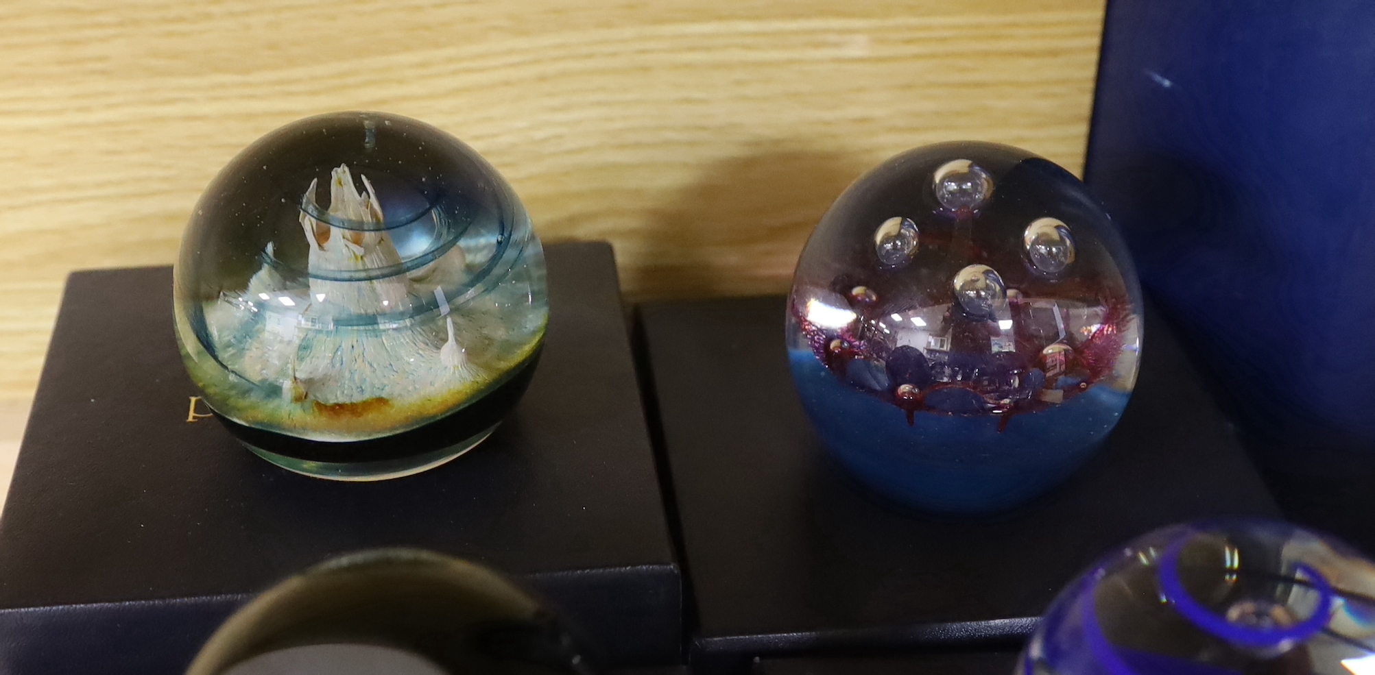 Ten Caithness paperweights including Viking Flame, limited edition 216/750 and Eterna, 175/500, each with boxes, the largest 7.5cm high
